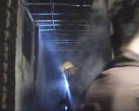 Firemen eventually extinguish the flames